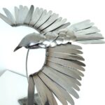 Oiseau en couvert en inox