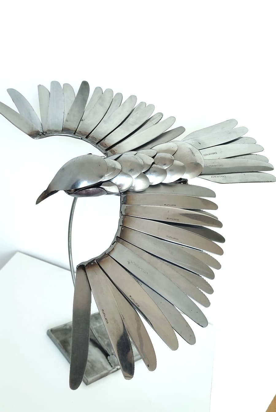 Oiseau en couvert en inox